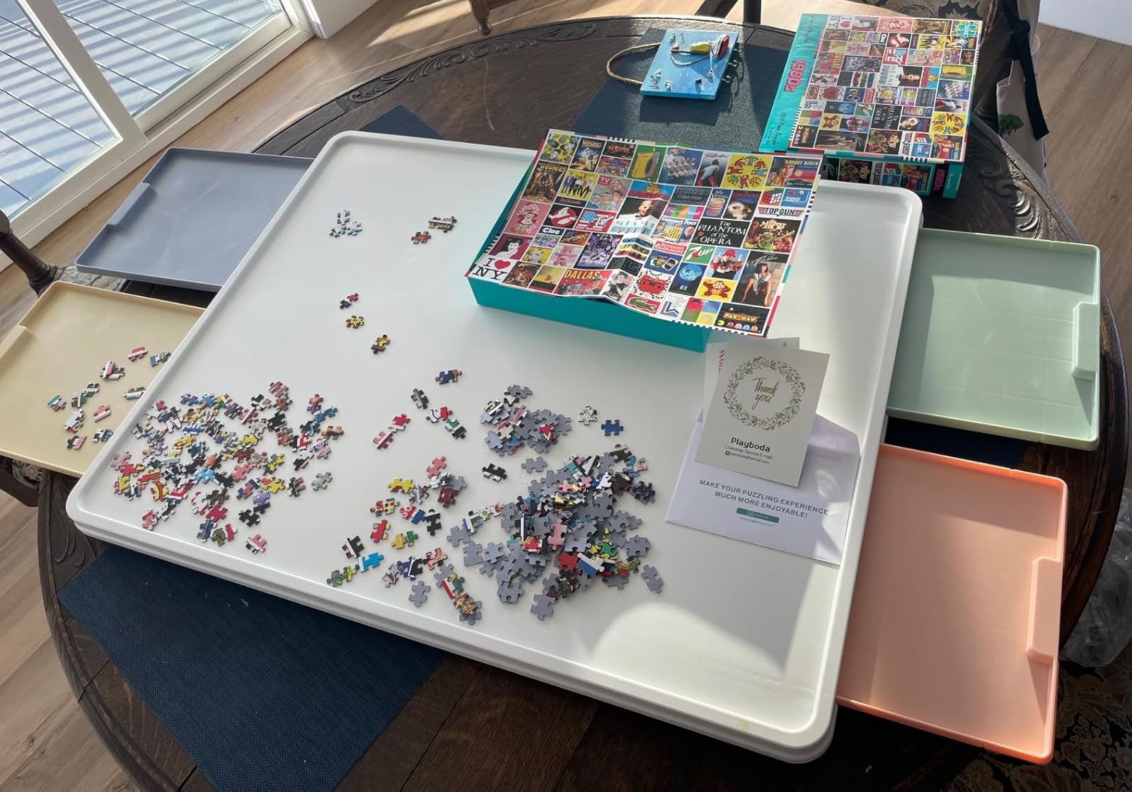 Customer review photo of 1000PCS whiteboard puzzle board with colorful drawers and puzzle pieces sorted by color