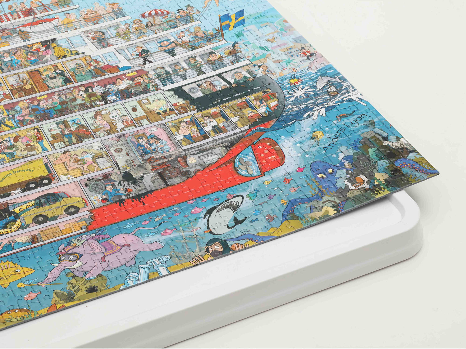 Whiteboard puzzle table with completed colorful jigsaw, shown alongside Playboda brand values highlighting simplicity, aesthetics, and quiet strength