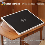 Protective rubber mat covering 1000 piece tilting puzzle board to prevent dust and damage